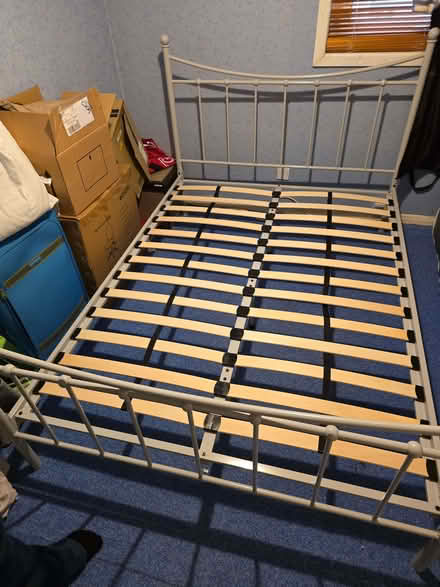 Photo of free 4'6" Grey Metal frame bed & Rest Assured mattress. (Barton OX3) #1