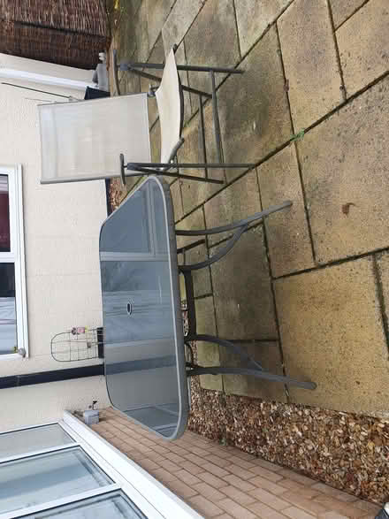 Photo of free Glass topped large garden table with 4 chairs. (Elstow MK42) #1