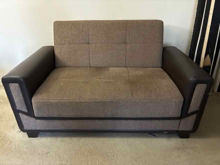 Photo of free Love seat convertible with storage (Columbia) #1