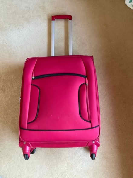Photo of free Medium red suitcase (East Carleton NR14) #1