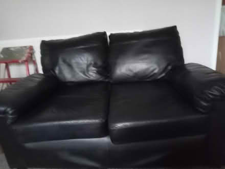 Photo of free 2x black leather sofas (M32 Stretford) #1