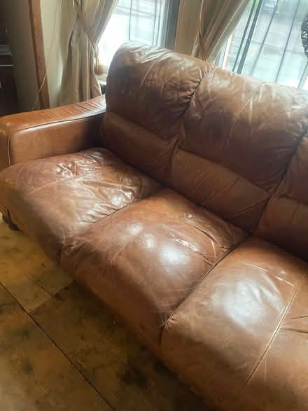 Photo of free Three seater real leather sofa (Great Yarmouth NR30) #1