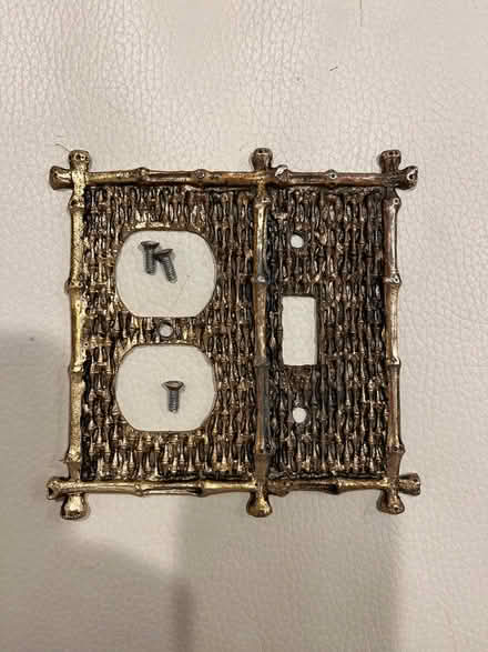Photo of free Metal outlet cover (brass?) (Randolph Hills (Ashley Drive)) #1