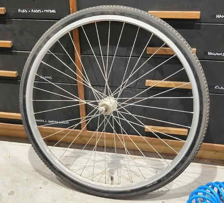 Photo of free Bicycle wheel (new just dusty) 37-590 (26 x 1 3/8) (Lawns SN3) #1