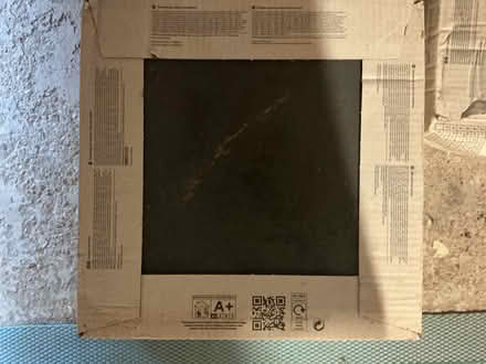 Photo of free Boxes of tiles, 1 box black, two cream (Seaford BN25) #2