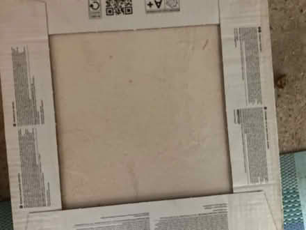 Photo of free Boxes of tiles, 1 box black, two cream (Seaford BN25) #1