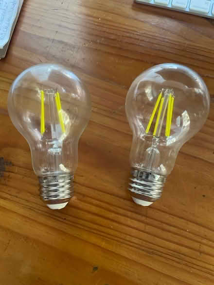 Photo of free two yellow light, light bulbs (Chevy Chase DC) #1