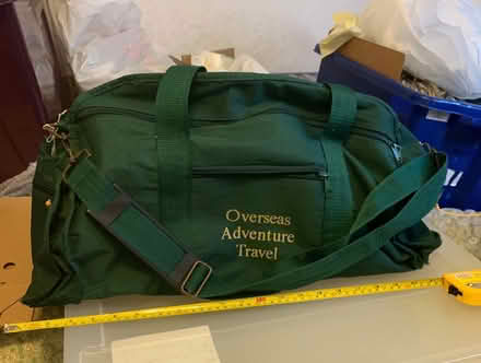 Photo of free Green hold-all ‘Overseas Adventure Travel’ (Osgodby YO11) #1