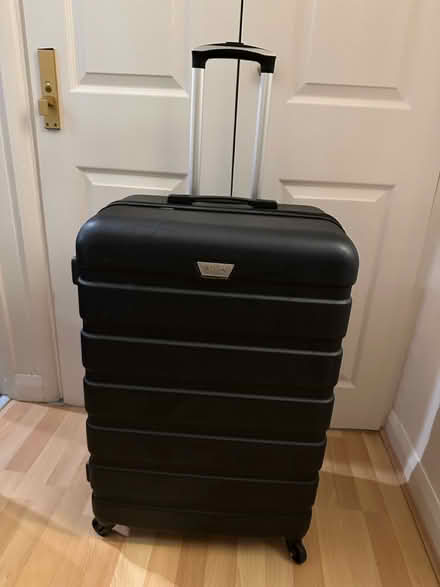 Photo of free Large hard shell black suitcase (Puckeridge SG11) #1