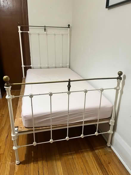 Photo of free Twin iron bed frame (Danforth and Greenwood) #1