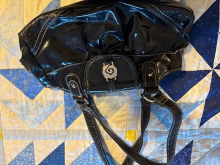 Photo of free Small shiny black rosette bag (Drexel Hill) #1