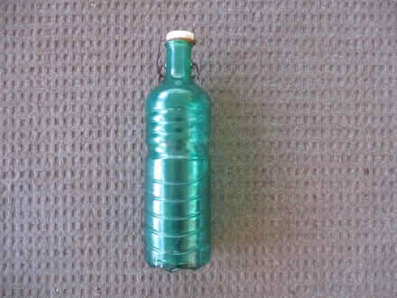 Photo of free green glass bottle with swivel lid (casselberry) #1