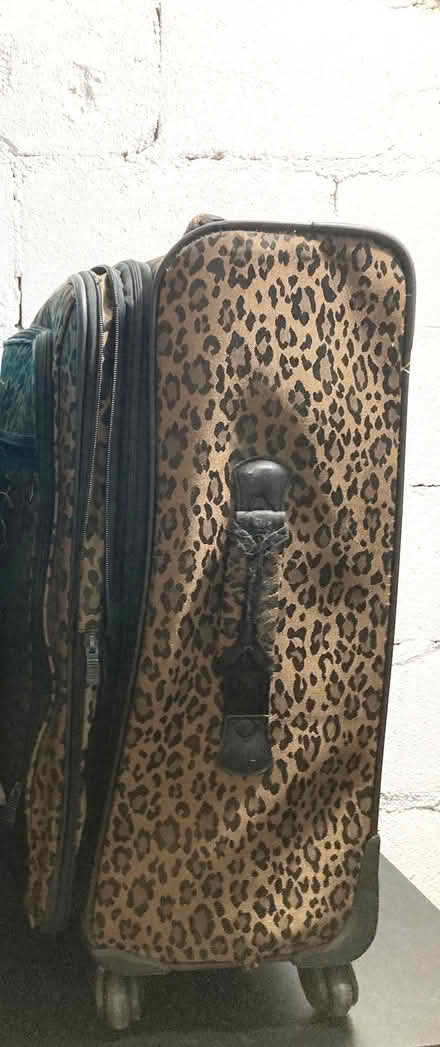Photo of free Leopard Print Rolling Suitcase (Midtown East) #1