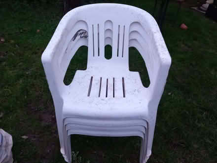 Photo of free Plastic chairs x 4 - white, stackable (Cashes Green GL5) #1