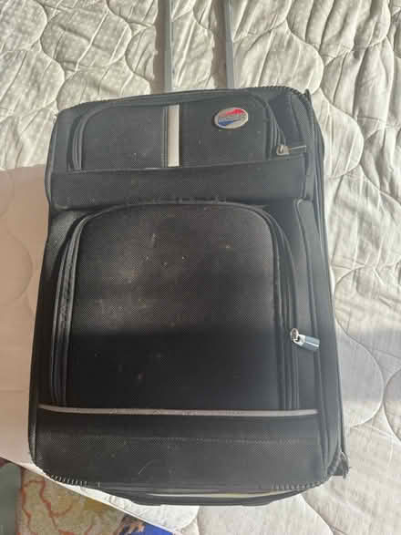 Photo of free black rolling suitcase (NE of Wrigley) #1