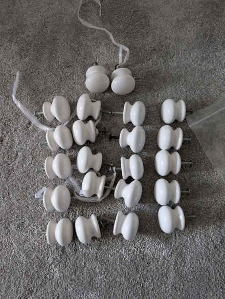 Photo of free 22 white cupboard/draw knobs (Burnmill Farm LE16) #1