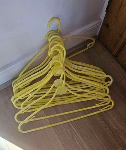 Photo of free Yellow plastic hangers (Windmill Court EX14) #1