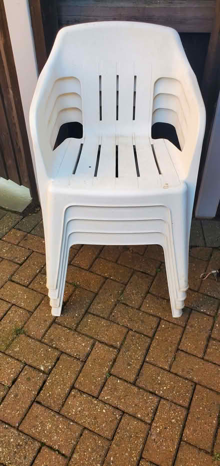 Photo of free 4 plastic stackable outside chairs (Epworth DN9) #1