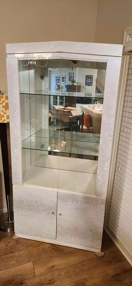 Photo of free Cabinet w glass shelves (805 pleasant hill rd Lilburn) #1