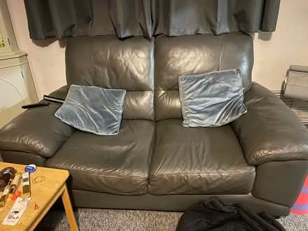 Photo of free 2 seater charcoal grey leather sofa (Southdown) #1