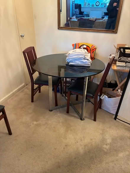 Photo of free Glass top dining table (S. 26th St. & S. Ives St) #1