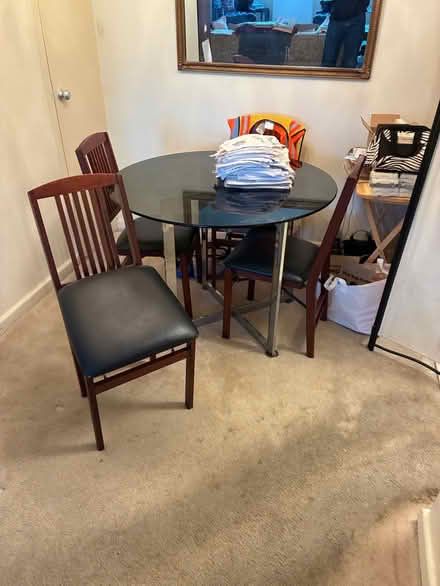 Photo of free Glass top dining table (S. 26th St. & S. Ives St) #2