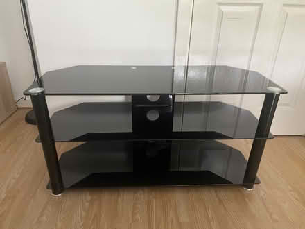 Photo of free Black Glass TV stand (NW10) #1