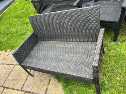 Photo of free Rattan two seat settee no cushions (Heywood OL10) #1