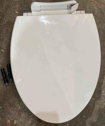 Photo of free Elongated white toilet seat (Stevens) #1
