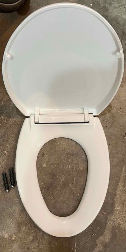 Photo of free Elongated white toilet seat (Stevens) #2