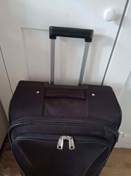 Photo of free Black wheeled suitcase 16'' wide 25" tall (Hove Station area BN3) #1