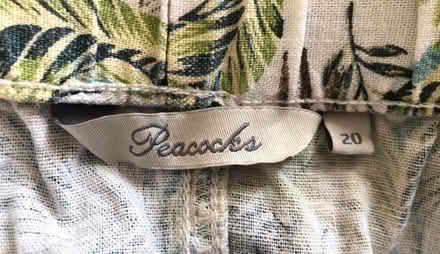 Photo of free Cream & green tropical print mini skirt, size 20. (Great Harwood BB6) #2