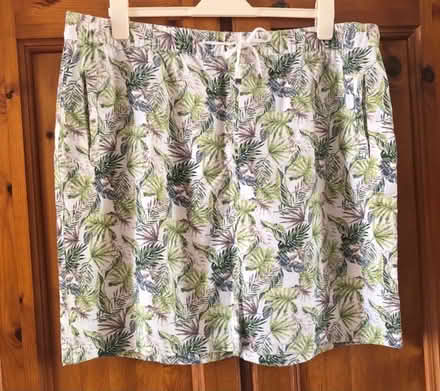 Photo of free Cream & green tropical print mini skirt, size 20. (Great Harwood BB6) #1