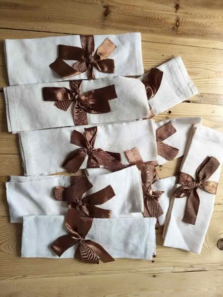 Photo of free 9 cream napkins with brown ribbon (Keynsham Memorial Park BS31) #1