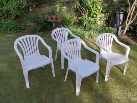 Photo of free White plastic patio set - 4 seats & oval table (Parkhead S11) #1