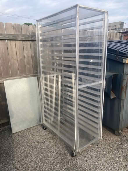 Photo of free Rolling metal shelving with cover (Creve Couer) #1