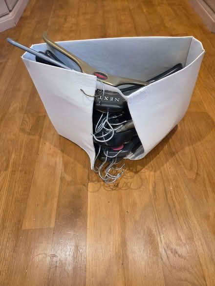 Photo of free Approx 20 assorted hangers in storage holder (Staveley LA8) #1