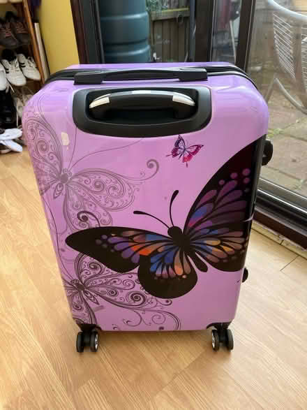 Photo of free Purple butterfly standard size suitcase (Dereham NR19) #1