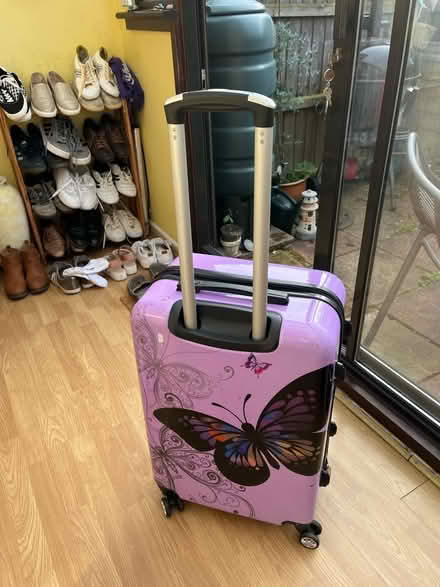 Photo of free Purple butterfly standard size suitcase (Dereham NR19) #2