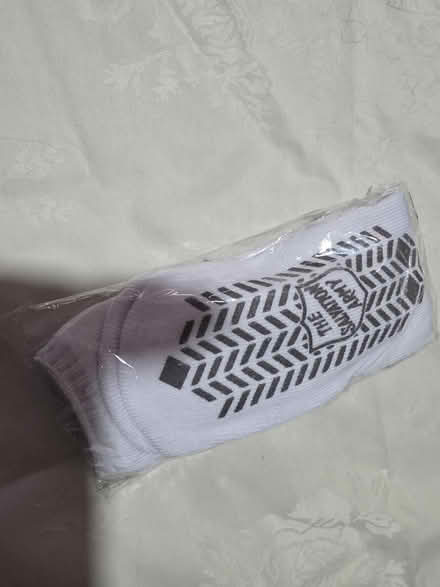 Photo of free Cream doily and white grippy socks (Near Downtown Ypsilanti) #1