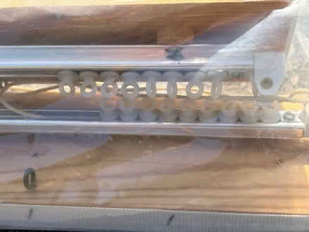 Photo of free 2 curtain tracks on board (West Horsley KT24) #2