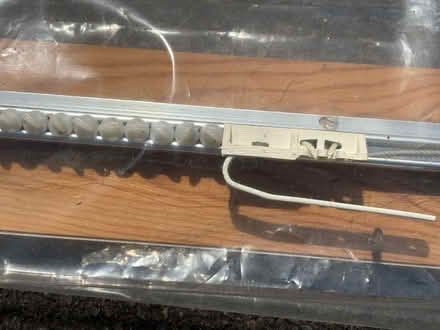 Photo of free 2 curtain tracks on board (West Horsley KT24) #4