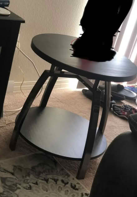 Photo of free Black wood top table (Moreno Valley) #1