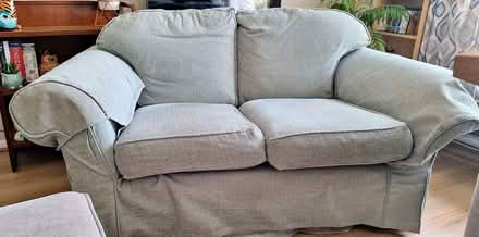 Photo of free Comfy Green Two-Seater Sofa - Fair Condition (Lyme Regis DT7) #1
