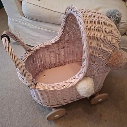 Photo of free Pink wicker dolls pram / cot (CB4 3RS) #1
